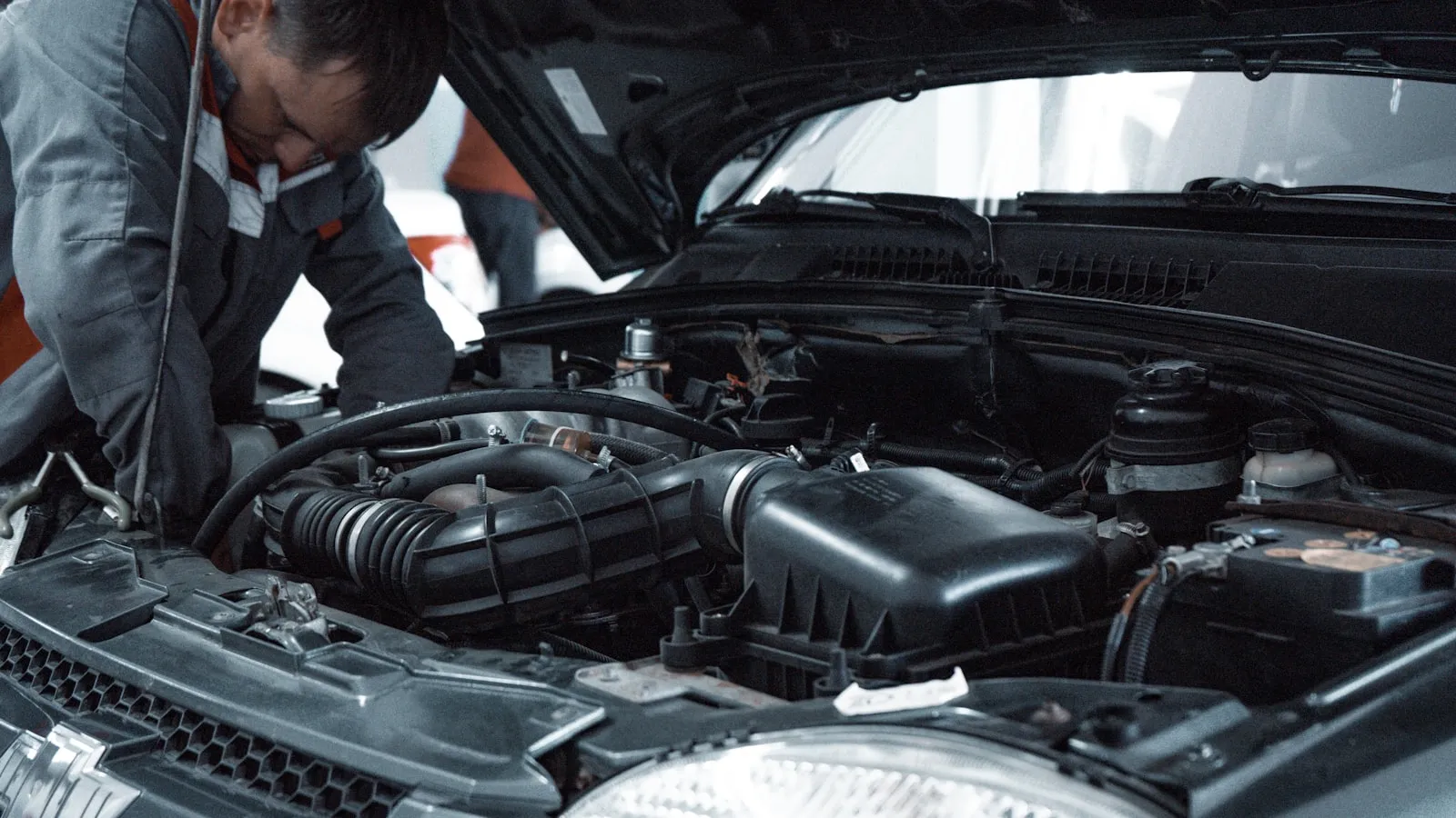 Technician handling engine components